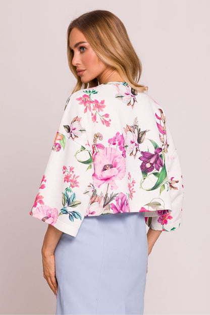 Moe oversized striped knit sweater displayed on a model, highlighting the comfortable fit and stylish boat neck for a chic casual look.