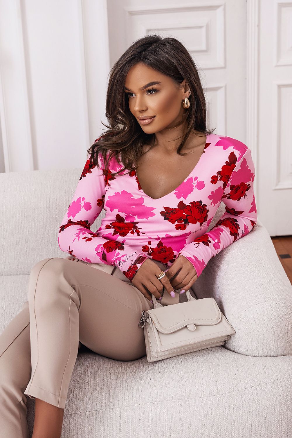 Essie Elegant Blouse by LaBalancia displayed elegantly, showing its versatility and eye-catching rose on blue colour combination.