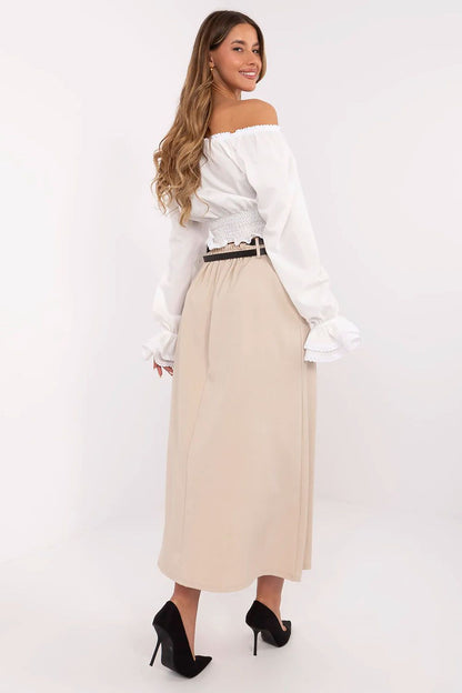 Model wearing Italy Moda's elegant maxi skirt, demonstrating its versatility for both casual and formal occasions.