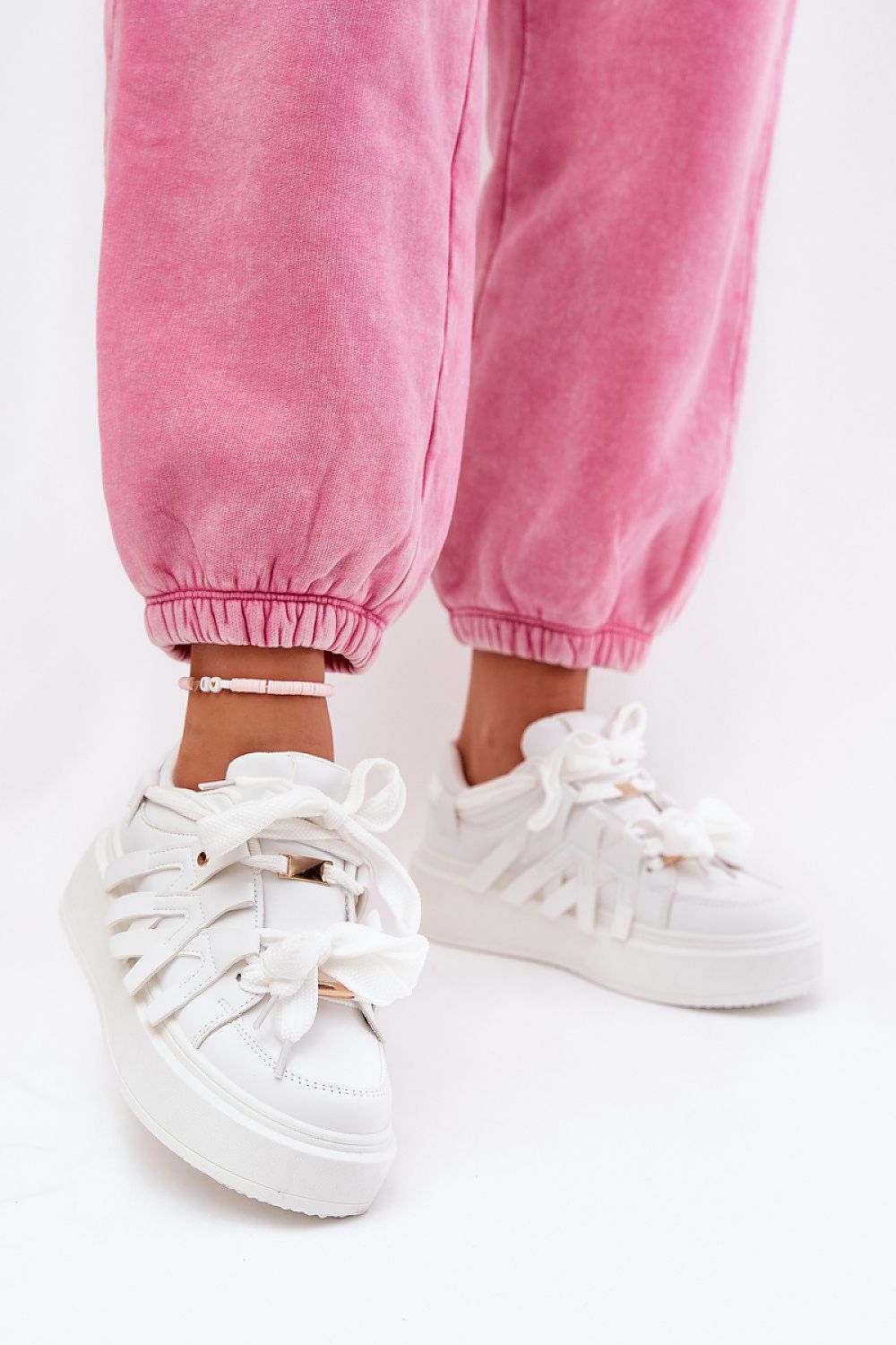 Luxury women's sneakers by Step in Style featuring a sophisticated design, crafted from synthetic leather, with a stylish platform for added height and comfort.
