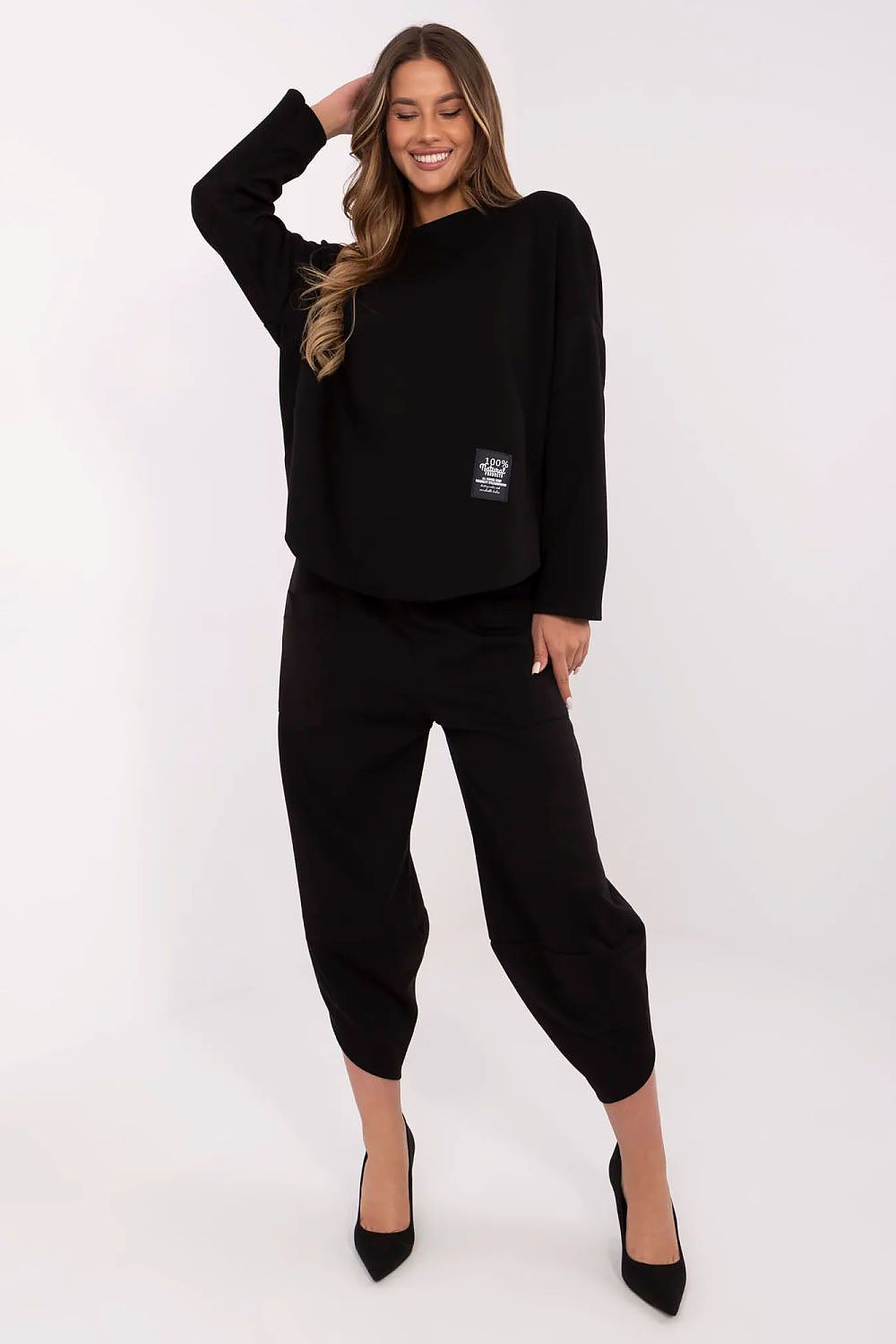 Italy Moda Women's tracksuit set displayed in an elegant setting, emphasizing soft fabric blend of viscose, cotton, and elastane.