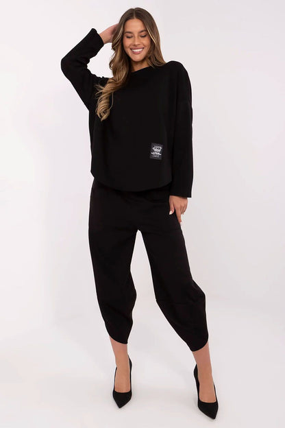 Italy Moda Women's tracksuit set displayed in an elegant setting, emphasizing soft fabric blend of viscose, cotton, and elastane.