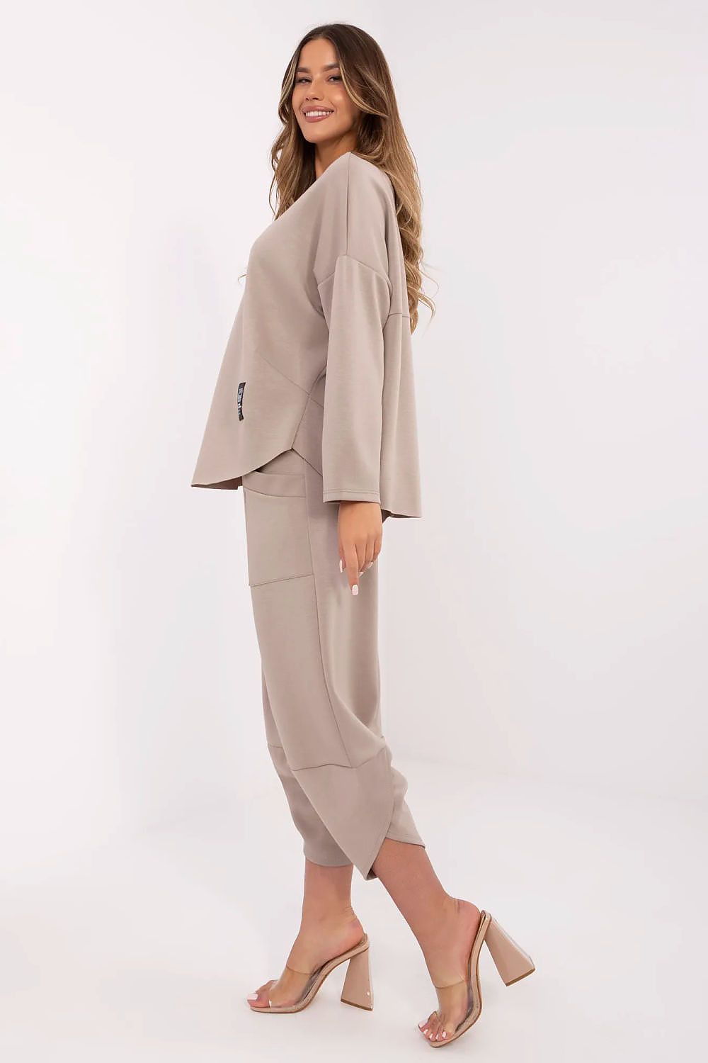 Stylish Italy Moda Women's tracksuit set displayed on a model, highlighting the elegant silhouette and trendy design details.