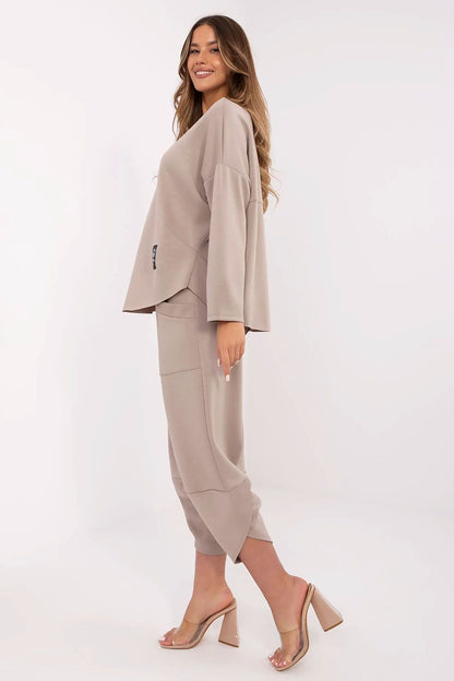 Stylish Italy Moda Women's tracksuit set displayed on a model, highlighting the elegant silhouette and trendy design details.