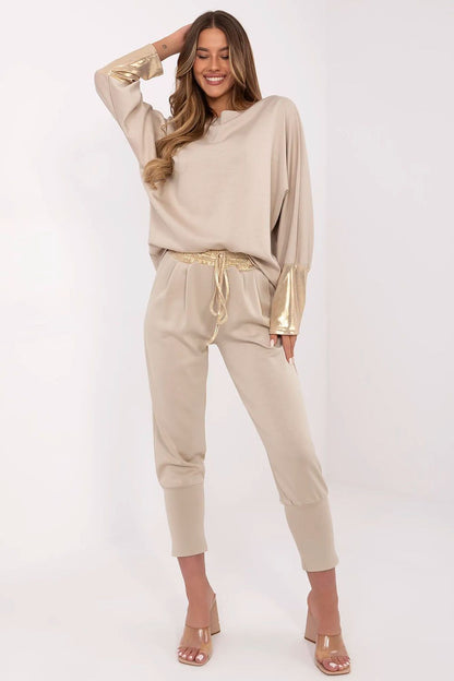 Luxurious elegant women's set by Italy Moda featuring a boat neck long-sleeved blouse and high-waisted pants, showcasing a soft viscose blend in size EU 0.