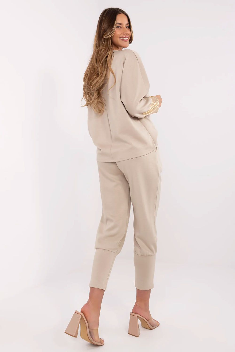 Exquisite long-sleeved boat neck blouse by Italy Moda, crafted from a soft viscose blend, highlighting golden sleeve finishes for a touch of elegance.