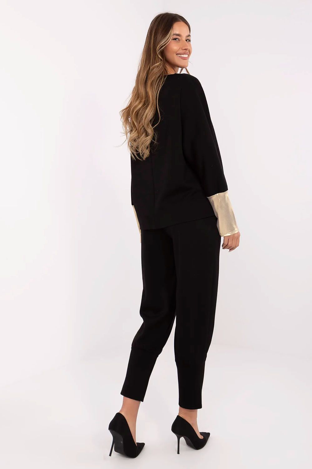 Close-up view of Italy Moda's elegant women's set showcasing the intricate details of the boat neck blouse and high-waisted pants, designed for comfort and sophistication.