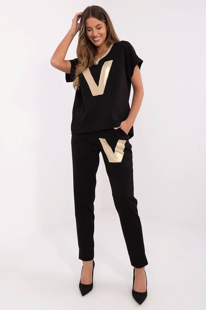 Italy Moda Women's Stylish Comfort Set featuring a luxurious V-neck blouse with a golden finish and elegant high-waisted pants, ideal for chic everyday wear.