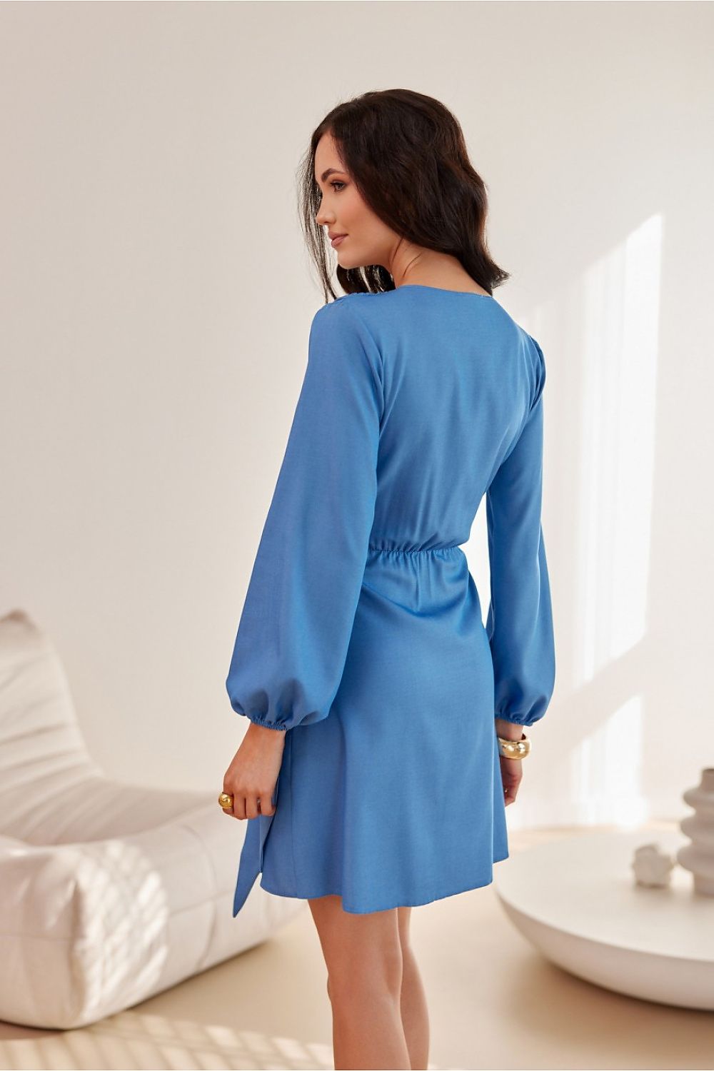 Elegant mini dress by Roco Fashion featuring long sleeves and a flared bottom, available in sizes EU 36-42.
