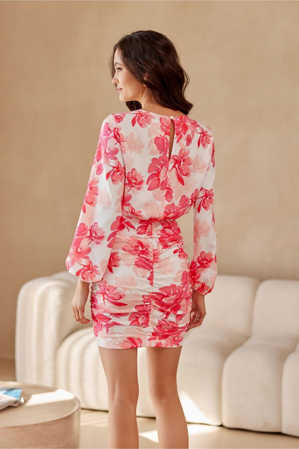 Elegant luxury mini dress by Roco Fashion featuring a decorative teardrop cutout and puffy sleeves in EU sizes 36-42.