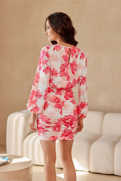 Elegant luxury mini dress by Roco Fashion featuring a decorative teardrop cutout and puffy sleeves in EU sizes 36-42.