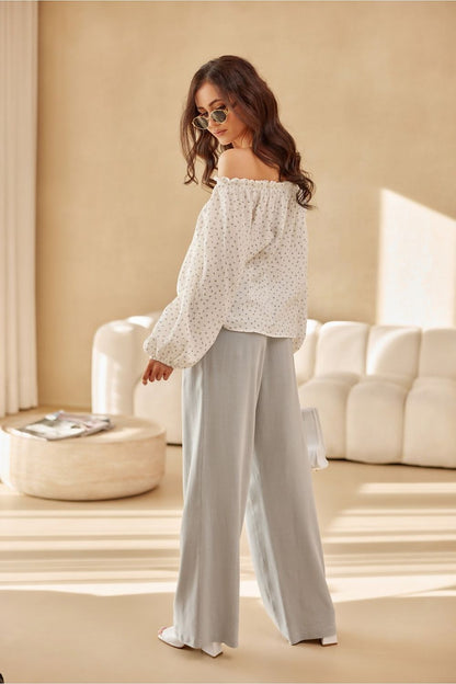 Stylish Roco Fashion Blouse featuring elegant puffy sleeves and a versatile adjustable neckline, perfect for sophisticated looks.