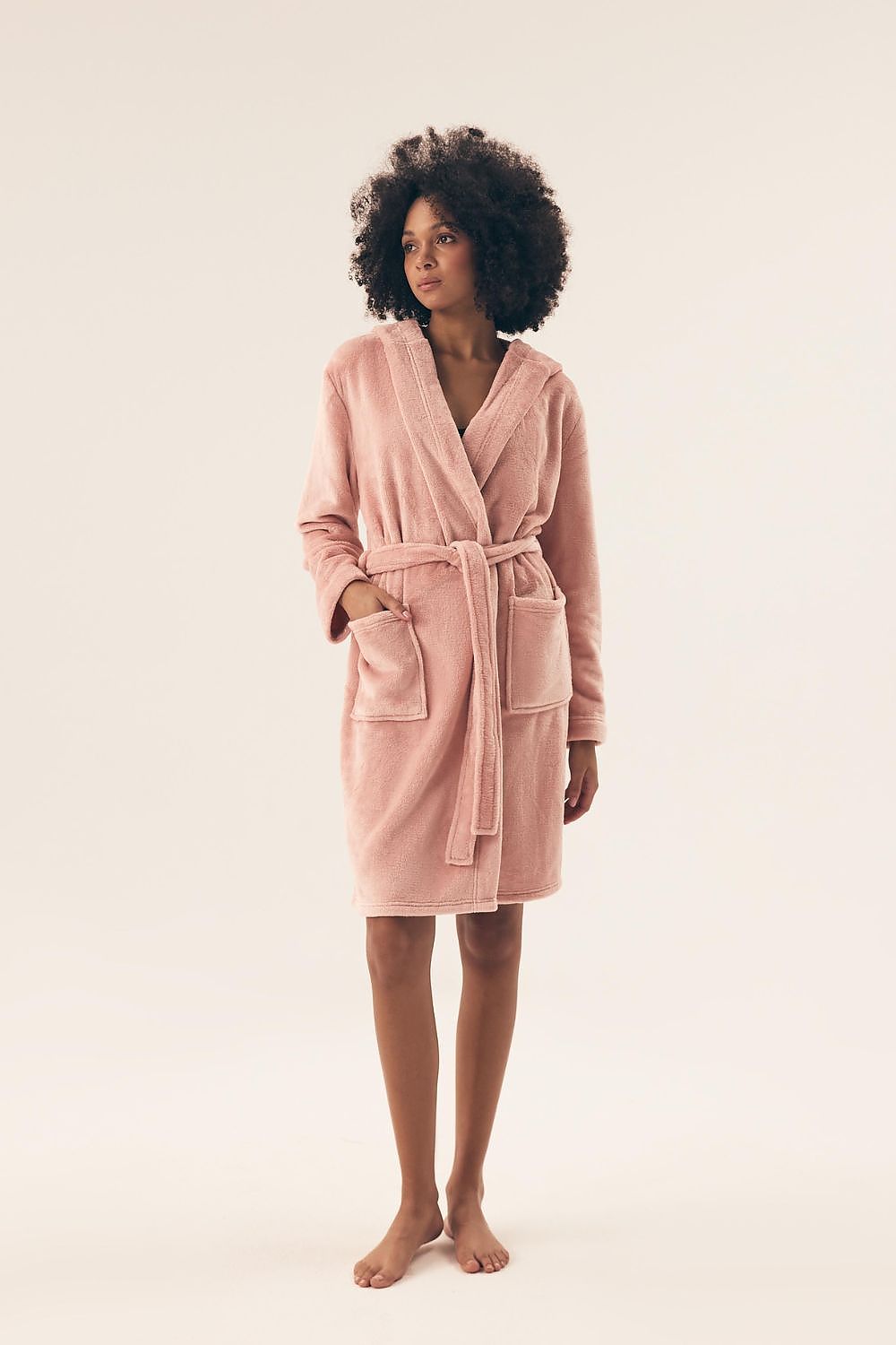 Henderson bathrobe model worn by a woman, demonstrating the luxurious fit and stylish above-knee length ideal for evening relaxation.
