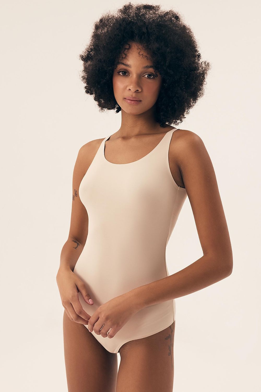 Luxury minimalist shapewear bodysuit by Henderson showcasing smooth fabric and adjustable straps, perfect fit for every silhouette.