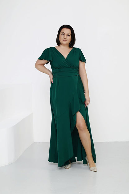 Jersa's feminine long dress, made from stretchy lightweight fabric, showcasing elegance with a flattering silhouette and perfect fit for warm weather.