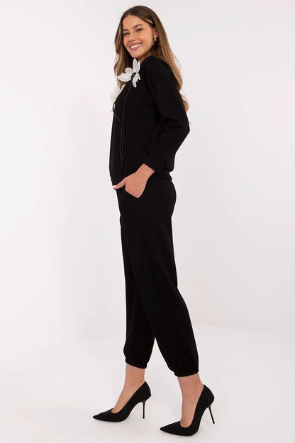 Sophisticated Italy Moda Women's High Waist Pants with side slip pockets and cuffs, perfect for casual styling and blending style with comfort.