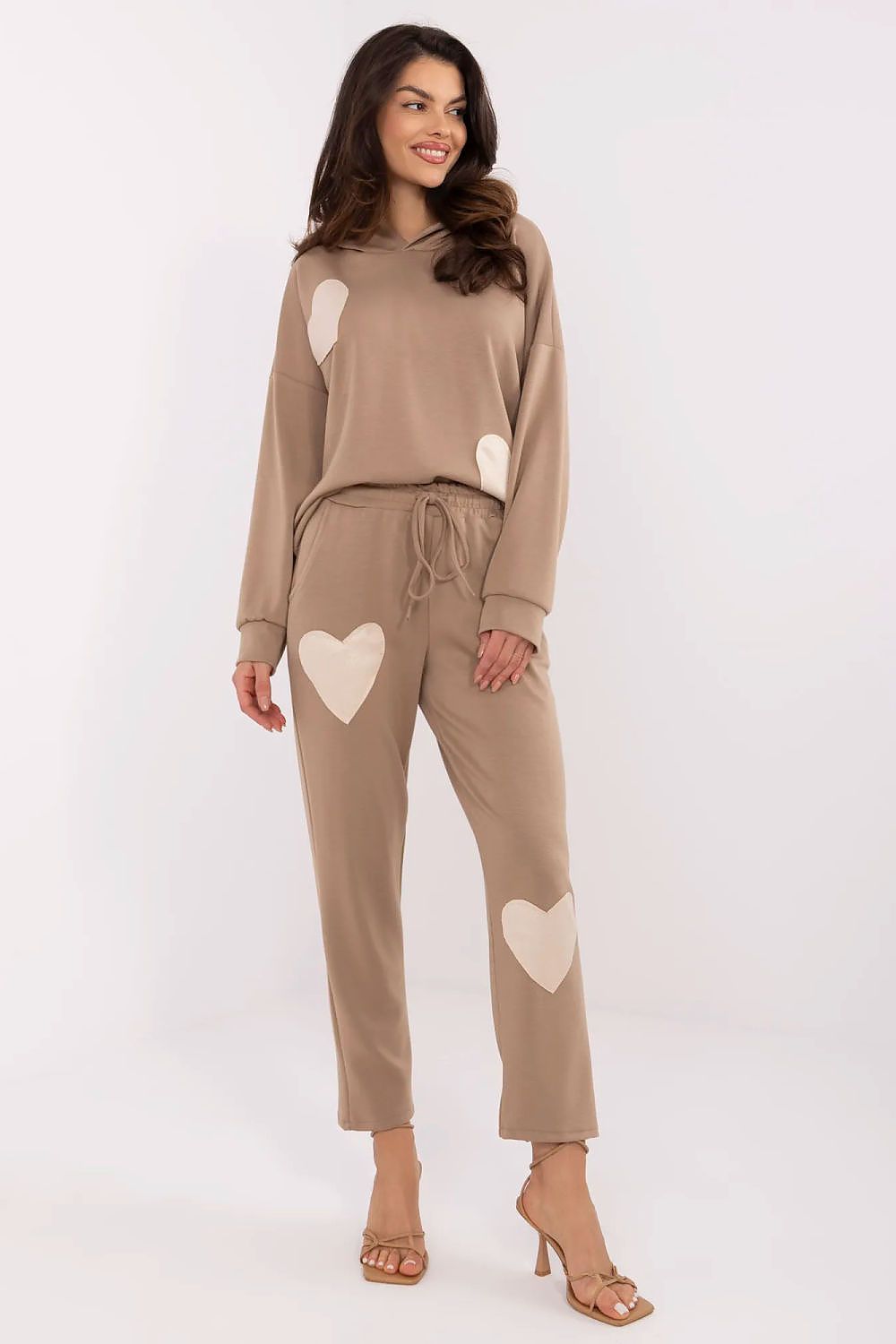 Italy Moda women's casual tracksuit displayed on a model, exuding comfort and style with a heart patch detail.
