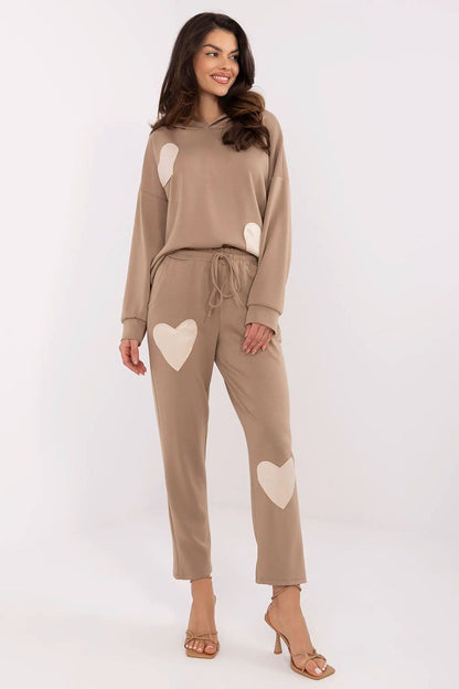 Italy Moda women's casual tracksuit displayed on a model, exuding comfort and style with a heart patch detail.