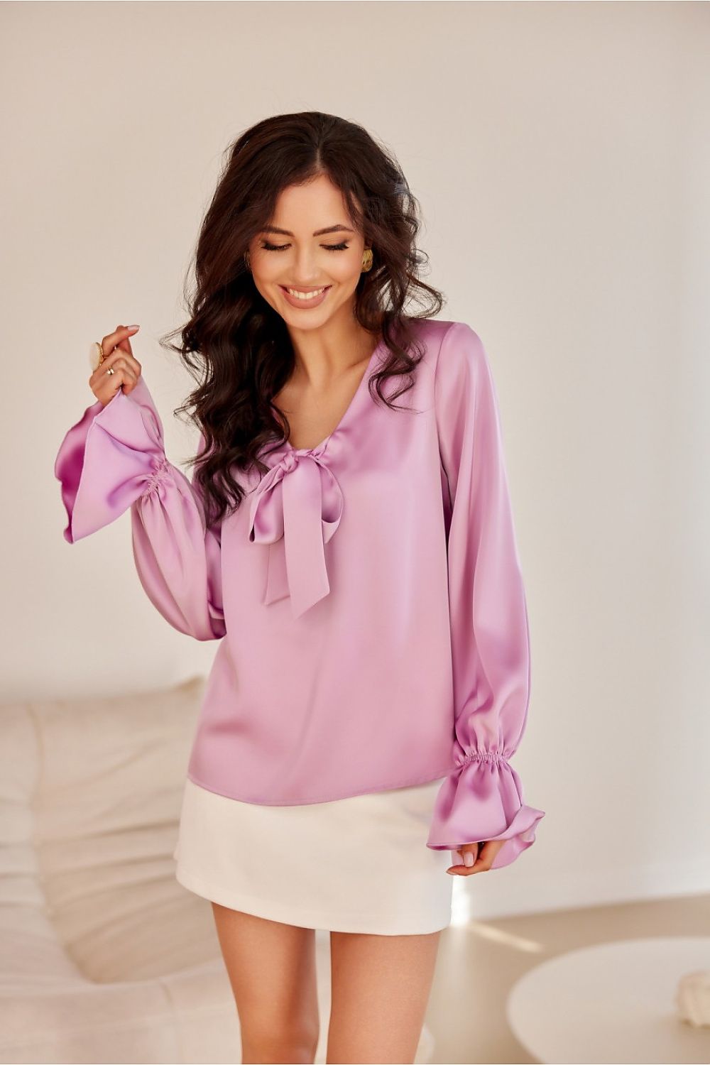Stylish Roco Fashion blouse designed with elastic banded long puffy sleeves, crafted from 100% polyester.