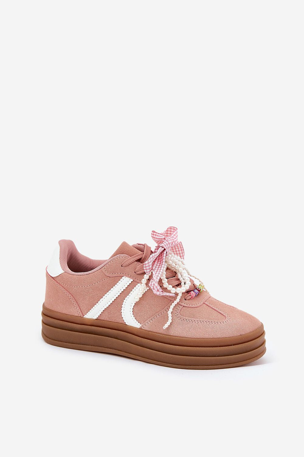 Step in Style eco-suede sneakers with a trendy platform design, embellished with charming laces for a feminine touch.