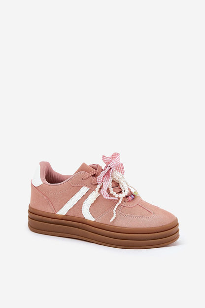 Step in Style eco-suede sneakers with a trendy platform design, embellished with charming laces for a feminine touch.