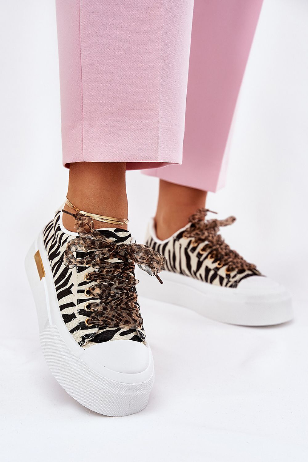 Chic and stylish women's platform sneakers by Step in Style, adorned with decorative lacing and cushioned foam insole for superior comfort, ideal for any sophisticated occasion.