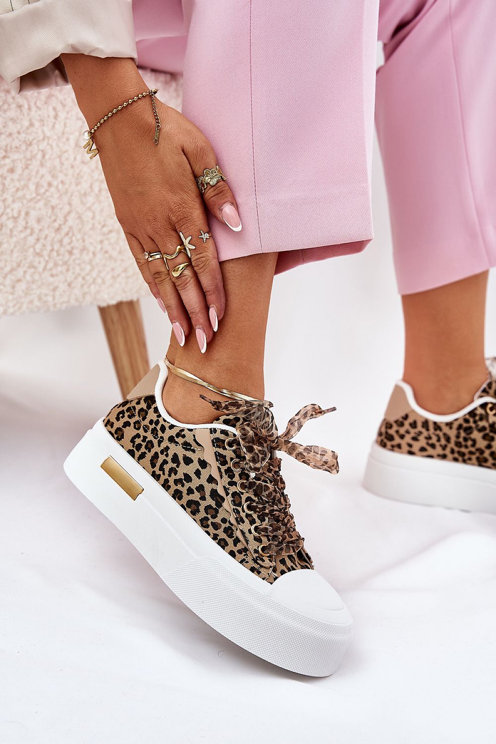 Sophisticated women's platform sneakers from Step in Style, featuring stylish decorative lacing and a soft foam insole, perfect for enhancing your high-end, casual ensembles.