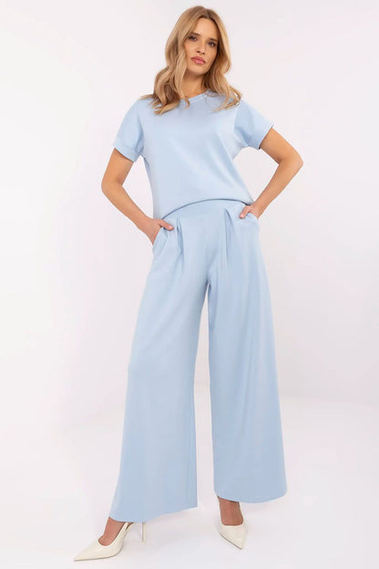 Elegant Palazzo-style tracksuit trousers from Relevance showcasing a high waist, wide leg design, and soft fabric blend for maximum comfort and style.