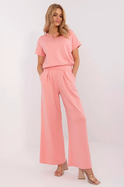 Stylish high waist palazzo trousers by Relevance featuring practical side pockets and decorative pleats for a sophisticated look.