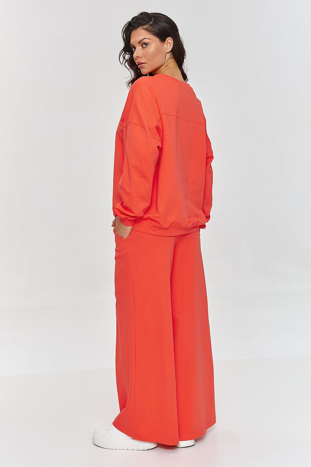 Elegant women's oversized tracksuit set by Makadamia, showcasing luxurious fabric and stylish flared design perfect for casual outings.