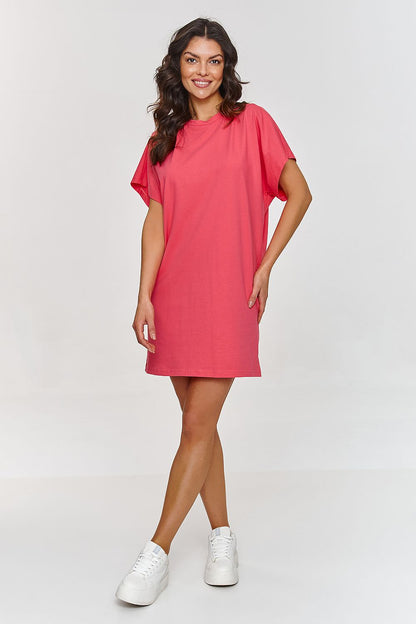 Model wearing the Makadamia stylish cotton daydress, elegantly paired with casual footwear, demonstrating versatility for everyday occasions.