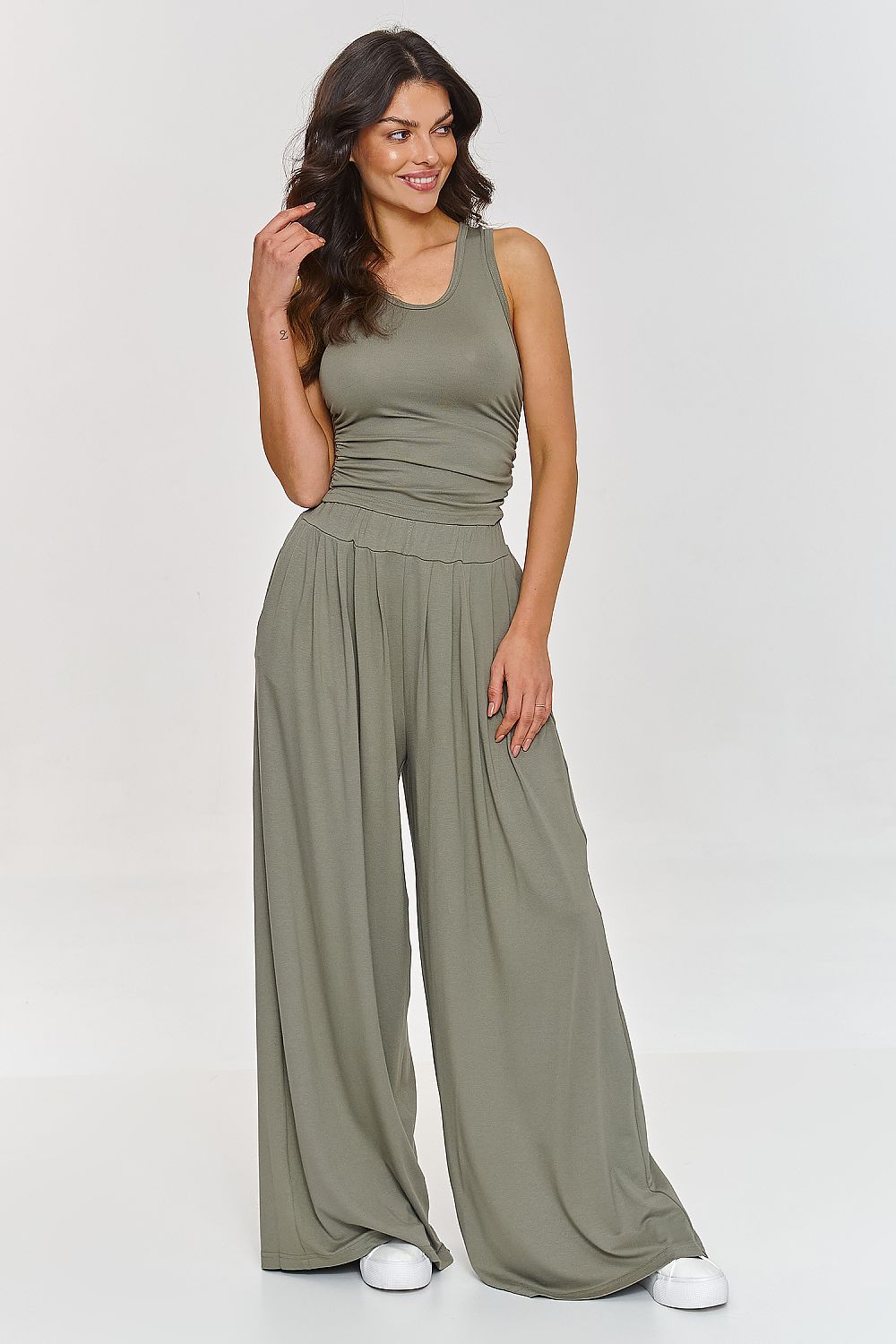 Luxurious close-up of Makadamia's viscose fabric showcasing the soft texture suitable for comfortable casual or semi-formal wear.