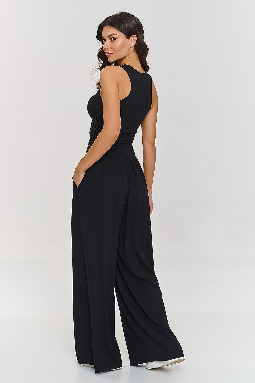 Lightweight viscose women's outfit by Makadamia, showcasing a stylish combination of a fitted top with embellished straps and wide trousers.