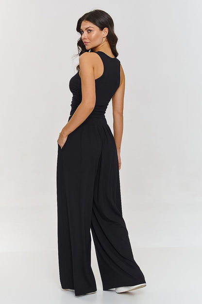 Lightweight viscose women's outfit by Makadamia, showcasing a stylish combination of a fitted top with embellished straps and wide trousers.