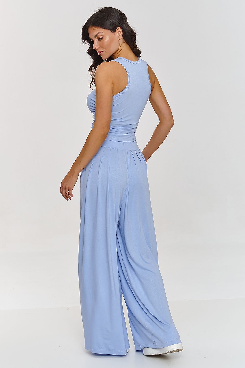 Fashion-forward high-waisted trouser set with fitted top by Makadamia, designed for elegance and comfort in warm weather.