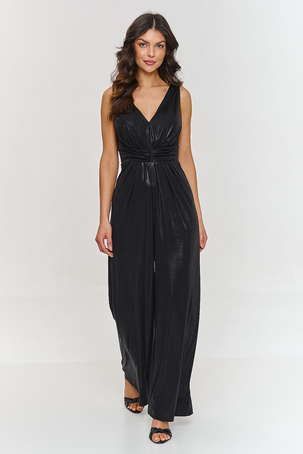 Back view of the elegant jumpsuit by Makadamia with a delicate cutout and zipper detail, designed for comfort and sophistication.