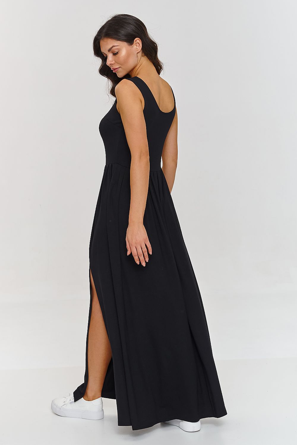 Elegant Makadamia maxi dress with a side slit, showcasing luxurious viscose blend fabric, perfect for spring and summer styling.