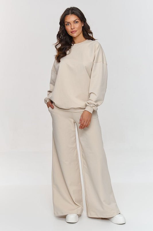 Luxury Makadamia oversized women's tracksuit set featuring a stylish and comfortable flared design, perfect for casual outings and relaxation.