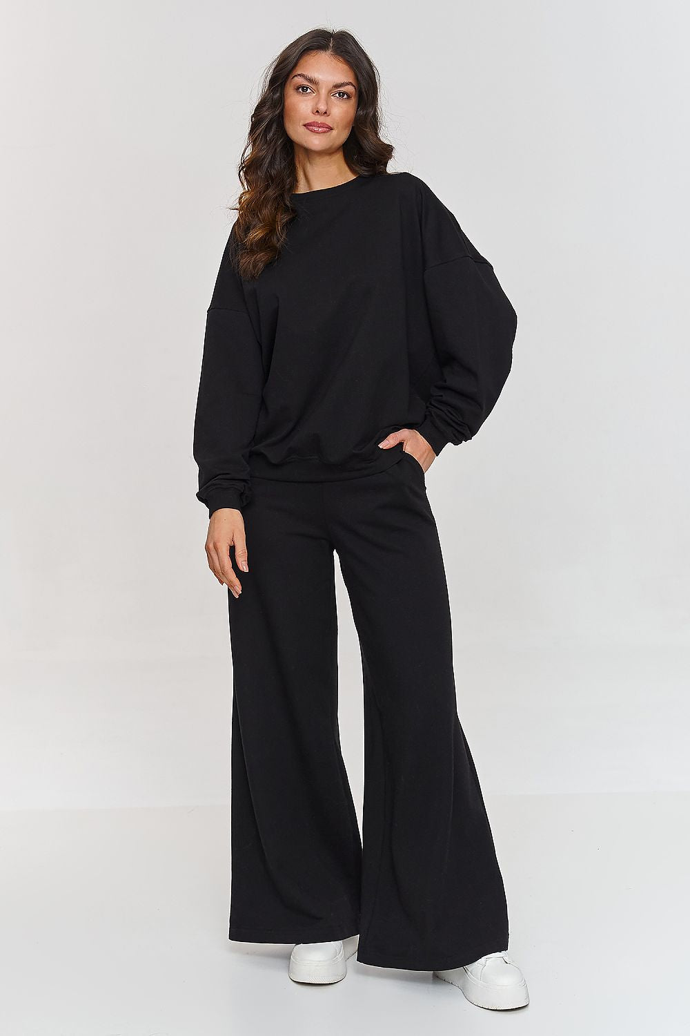 Sophisticated Makadamia women's tracksuit set showcasing a modern oversized silhouette, perfect for casual outings or lounging.