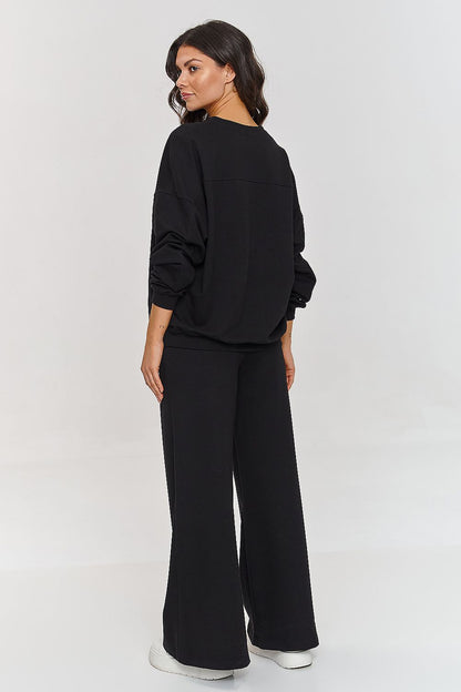 Trendy Makadamia women's flared tracksuit set, designed for style and comfort, ideal for both home and social wear.