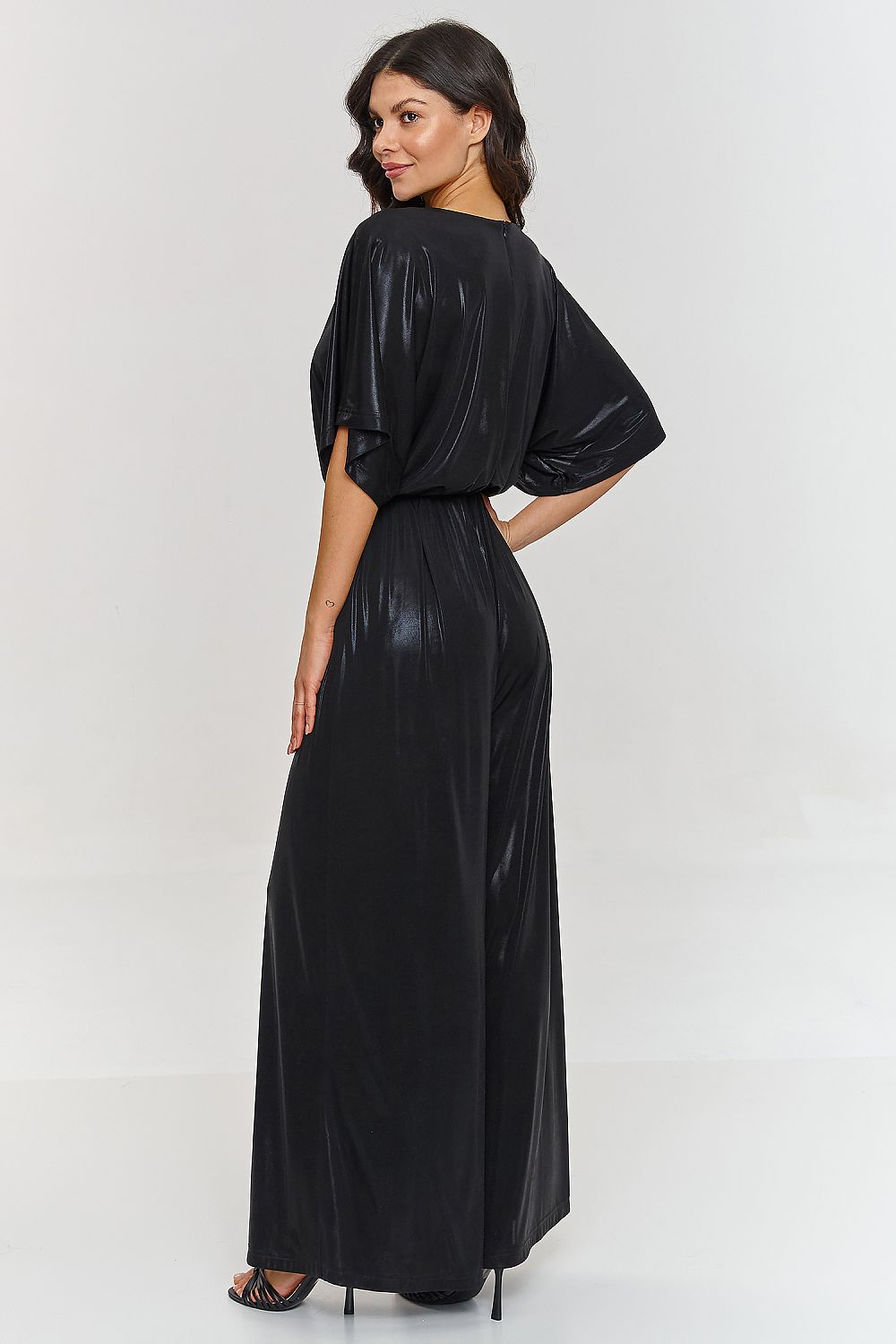 Close-up view of the delicate metallic fabric of the Luxury Makadamia jumpsuit, highlighting its unique shine and modern character.