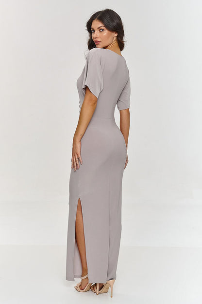 Elegant Makadamia maxi dress with V-neck and side slit, showcasing a slender silhouette perfect for formal occasions.