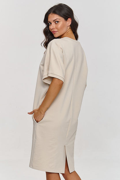 Makadamia's elegant above-the-knee short sleeve dress, designed with functionality in mind, featuring discreet side pockets for a blend of practicality and style.