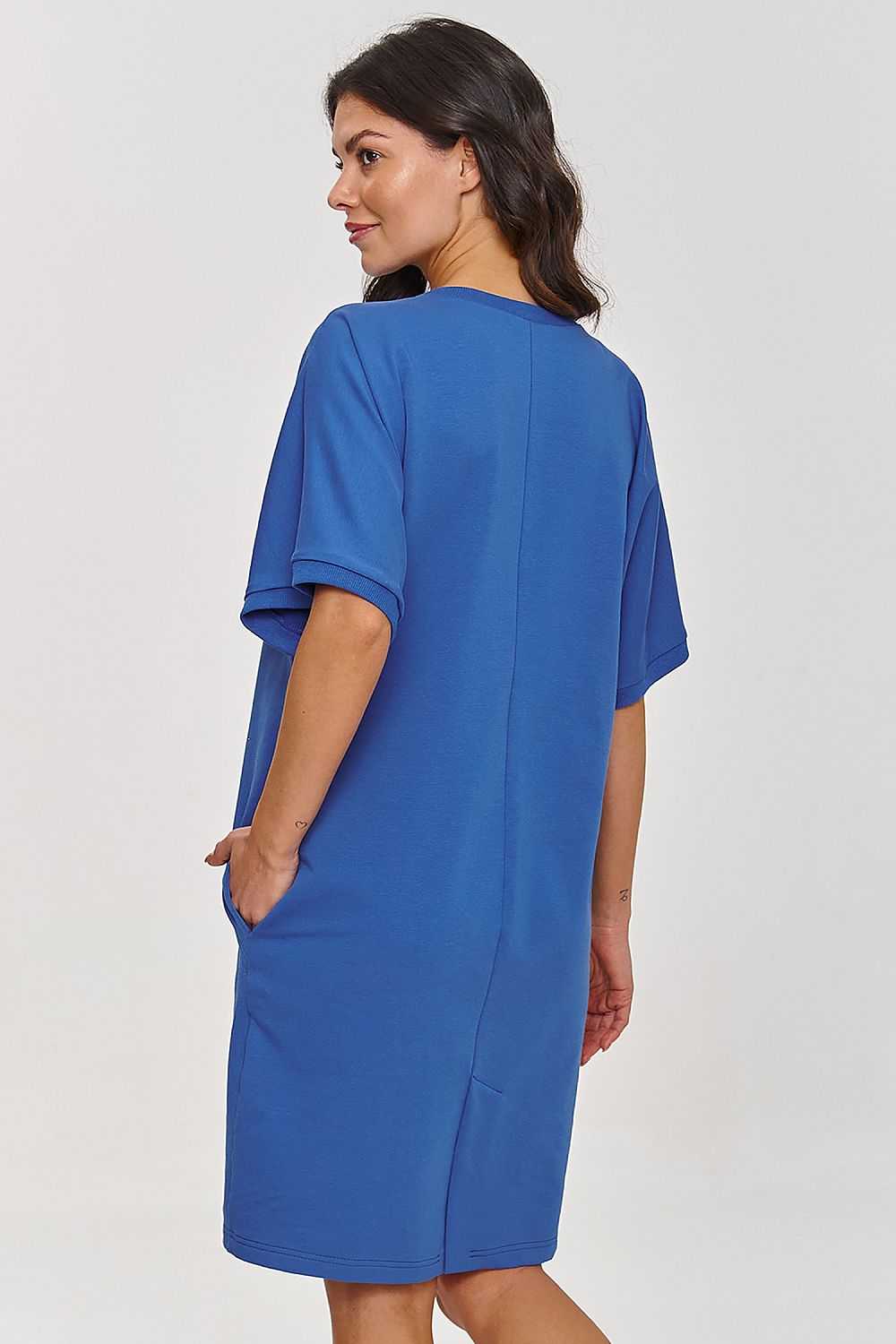 The luxurious Makadamia daydress with elbow-length sleeves and above-the-knee length, designed for a fresh and elegant silhouette.