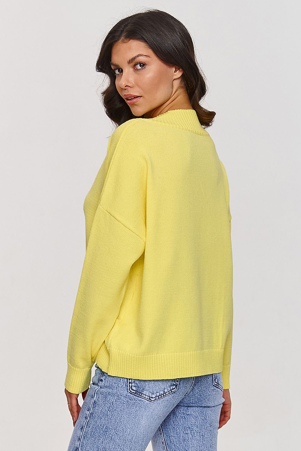 Close-up of Makadamia V-Neck Sweater's high-quality viscose fabric highlighting its durability and elegant V-neckline, perfect for timeless style.