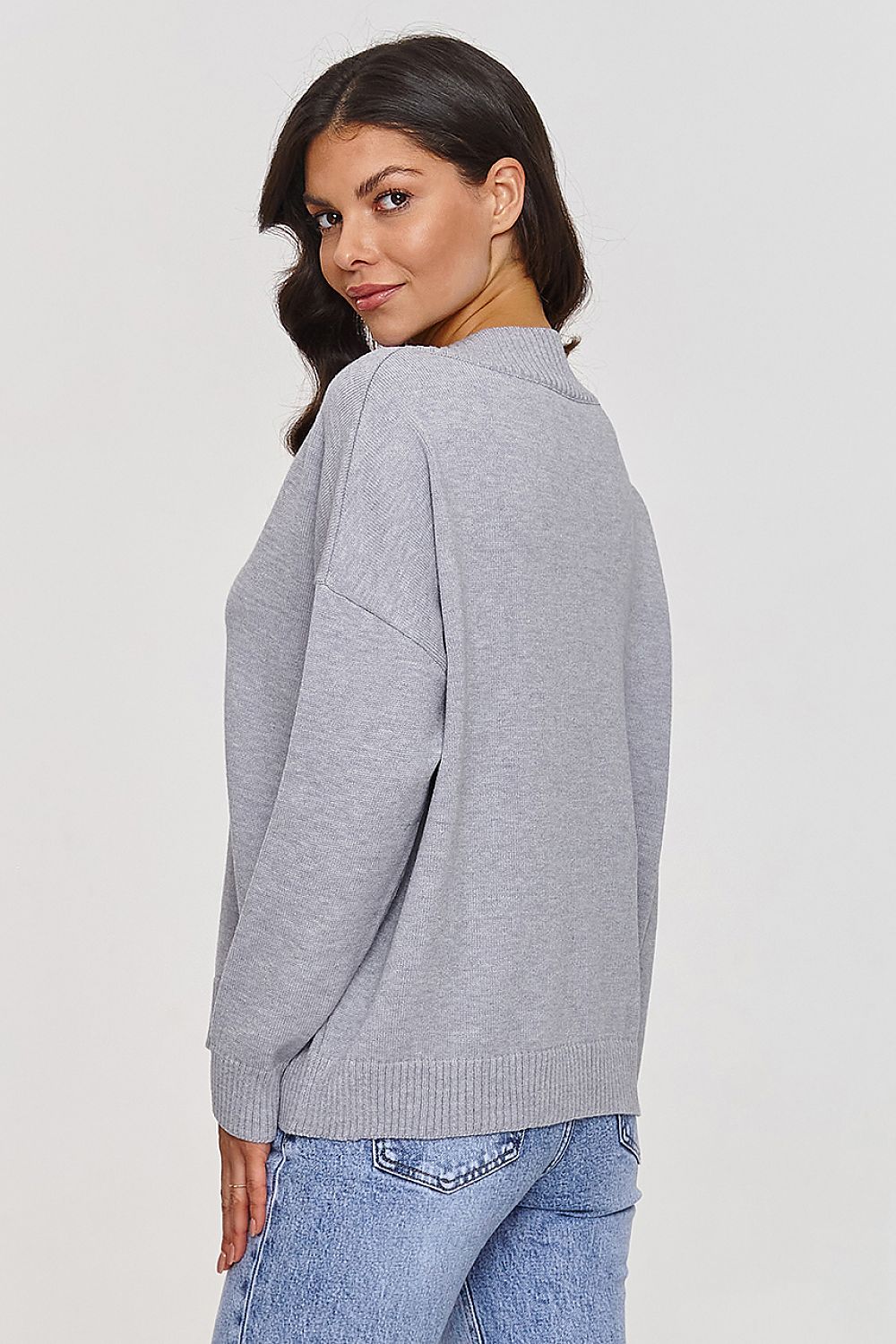 Flat lay of Makadamia V-Neck Sweater in pristine condition, showcasing its elegant cut and modern design, suitable for both casual and formal occasions.