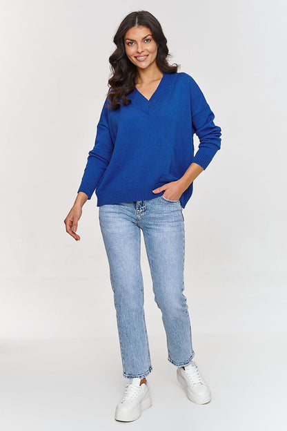 Detail of the ribbed cuffs and elegant V-neck of Makadamia's V-Neck Sweater, emphasizing its modern design elements.