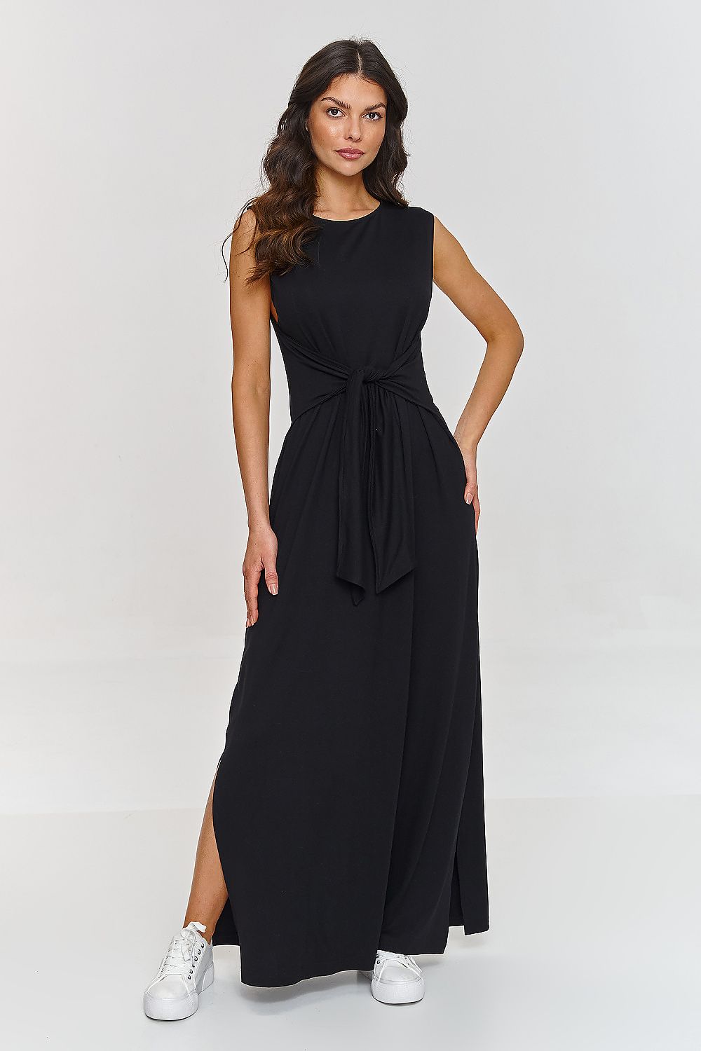 Sophisticated Makadamia dress with a modern side slit and classy maxi length, versatile for both casual and formal occasions.