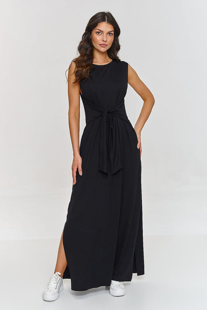 Sophisticated Makadamia dress with a modern side slit and classy maxi length, versatile for both casual and formal occasions.