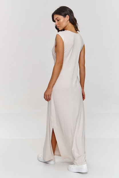 Refined Makadamia maxi dress with vibrant spring colours, elegantly designed with a comfortable waist tie and flirtatious side slit.